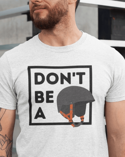 close up of a man wearing a funny graphic t-shirt which reads "don't be a helmet"