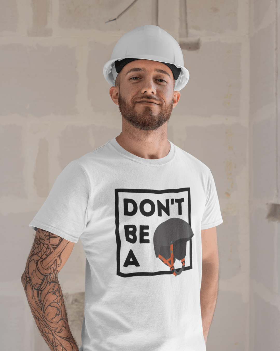 man wearing a funny graphic t-shirt which reads "don't be a helmet"